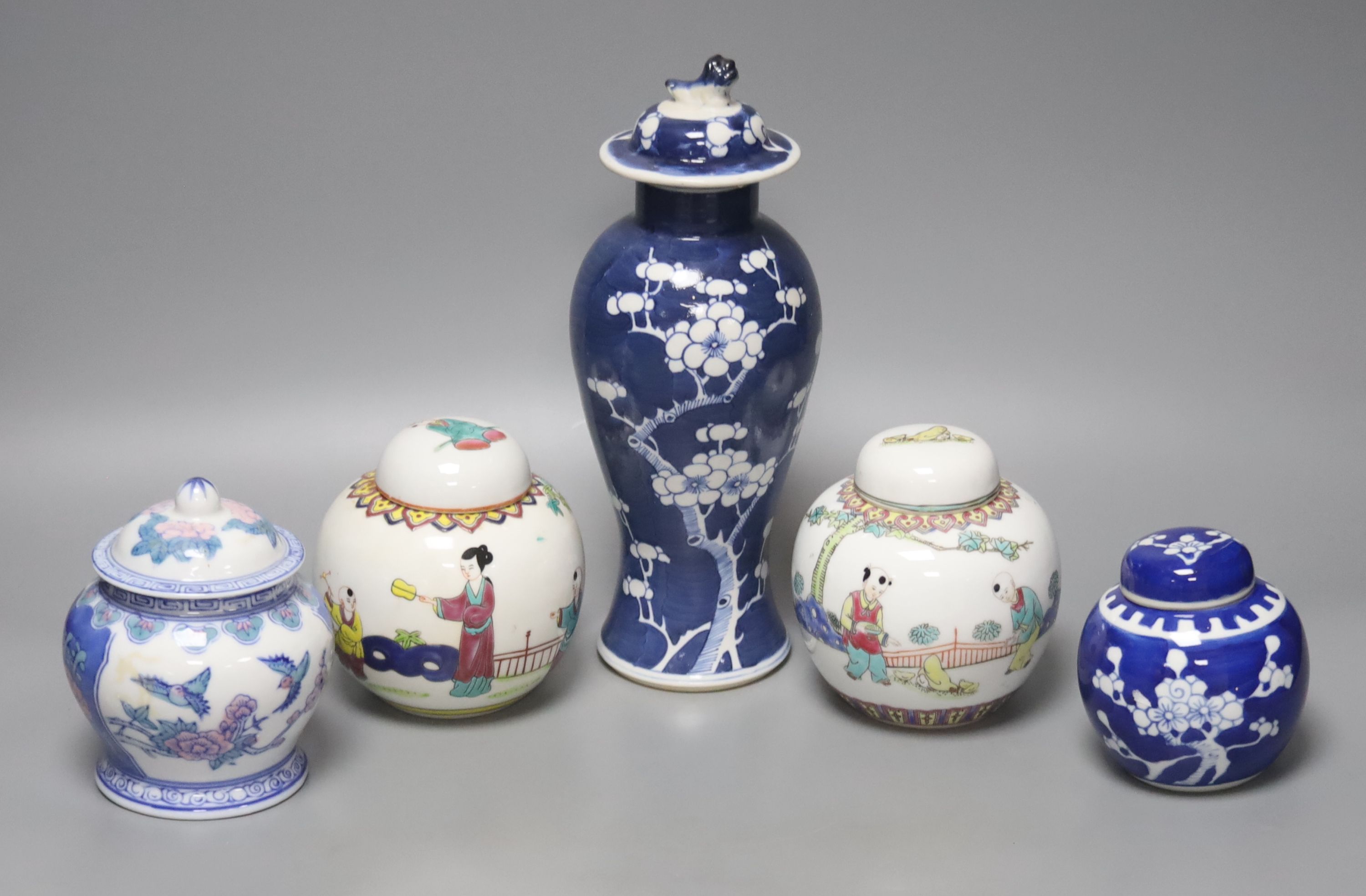 A Chinese blue and white vase and cover, a pair of famille rose jars and covers and two other jars and covers, tallest 27cm